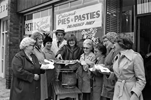 Meat Prints: Customers waiting for their meat pies to warm up on the Calor gas cooker provided by