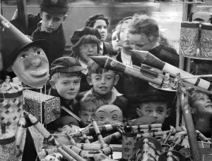 Rockets Prints: Customs Guy Fawkes Day: A jumble of small faces peer at a pile of very big bangers