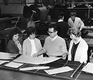 Textiles Prints: Cutter D Hoskins demonstrating to female workers at the Steinberg
