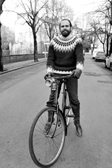 Cycling journalist and writer Mr. Richard Ballantine riding a bicycle February