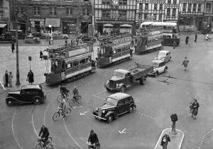 Bikes Prints: Cyclist negotiate a busy Bristol Tramway Centre June 1939