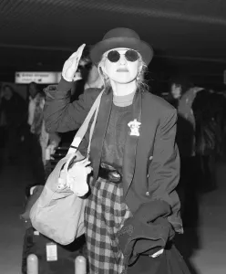 Cyndi Lauper american singer songwriter pictured with manager David Wolff arriving