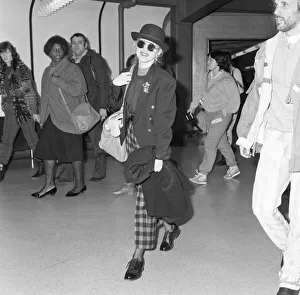 Cyndi Lauper american singer songwriter pictured with manager David Wolff arriving