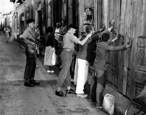 Terrorism Prints: Cyprus War - British soldiers search Cypriots in a spot check in Nicosia