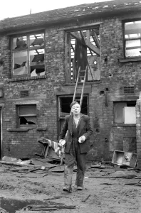 00044 Prints: Cyril Eachus seen here leaving his old works building after being evicted by baliliffs