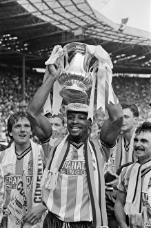 Wembley Prints: Cyrille Regis holds the FA Cup aloft after his team Coventry beat Tottenham Hotspur 3-2