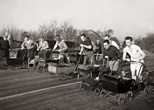 00102 Prints: Dads take part in a Pram Race in Bognor Sussex on Boxing Day Pram - Men