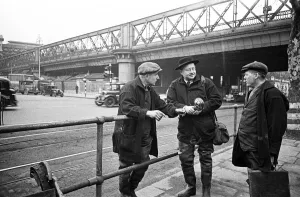Photographer Prints: Daily Mirror photographer Bela Zola pictured in the centre