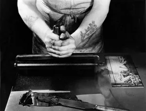 Tattoo Prints: A Daily Mirror photographic engraver inks a plate so he can check his work before passing