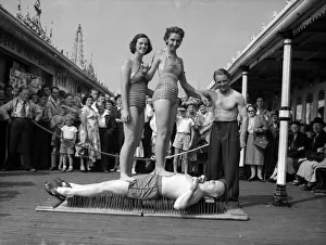 Tourism Prints: Daily Mirror reporter Eric Wainwright accepted a challenge from the strong man