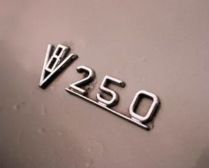 Classic Prints: DAIMLER V8 KENNETH MCFADDEN February 1998 Detail of badge 250