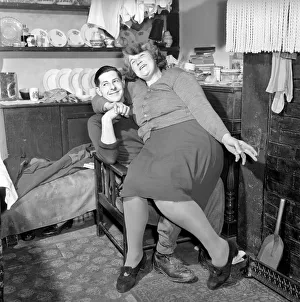 Cuddle Prints: Daisy and Norman Bowen seen here at home. January 1954 A139-002