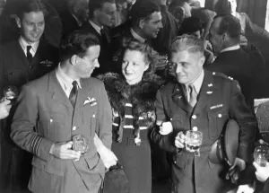 Award Ceremonies Prints: Dam Busters. Wing Commander Guy Gibson and Mrs Gibson talking with Captain W. K Clark, U