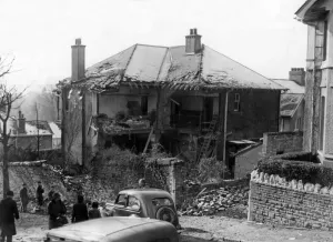 01436 Prints: A damaged house in South Wales following an attack by Nazi raiders. Circa 1941