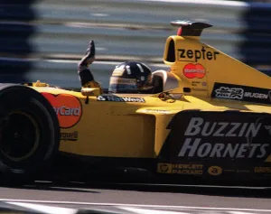 Damon Hill at the British Grand Prix July 1999 waves to the crowd at the end of