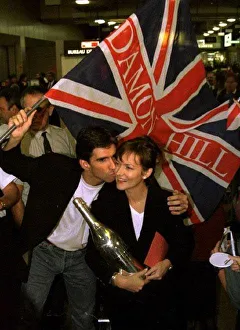 Damon Hill Formula One World champion and his wife Georgie arrive at Heathrow airport