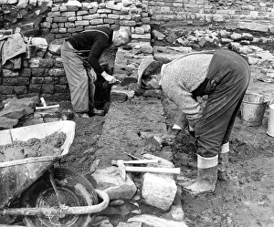 History Prints: Dan Wilkinson and Raymond Johnson renovating a fresh section of the Roman fort