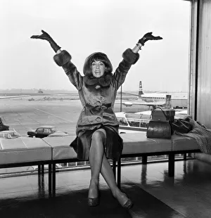 Ballerina Prints: Dancer, choreographer and actress Gillian Lynne arriving at London Airport after flying