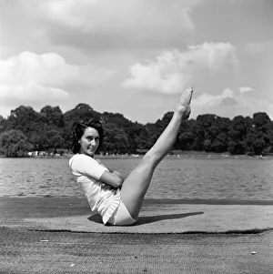 01269 Prints: Dancer Gillian Lynne has her own idea of a sitting position whilst taking the sun