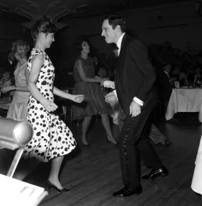 Tuxedo Prints: Dances The Twist. Anthony Newley and Alma Cogan in the background dancing at The Hungaria