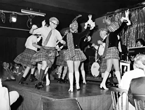 Skirt Prints: Dancing girls in mini-kilts and sporrans performing at the Caledonian Suite night club