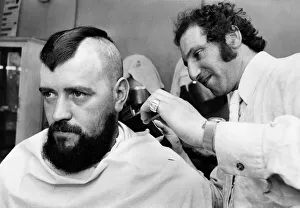 Barber Prints: Daniel Ferran a gas fitter from Glasgow getting a mohican hair cut. 29th May 1972