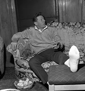 Danny Kaye at the Dorchester Hotel London nursing his badly burned foot He