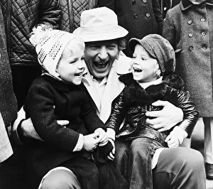 Boys And Girls Prints: Danny Kaye making two toddlers laugh in London - November 1971 Guy Murray
