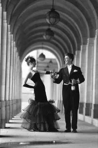 Young Couple Prints: Two darlings of the deb set offer a toast to fashion as they prepared for a night of