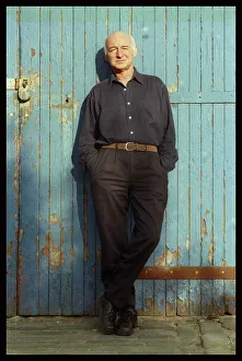Hands In Pockets Prints: Dave Anderson actor stands at blue door June 1998 hands in pockets