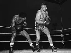 Punch Prints: Dave Charnley (right) and Joey Lopes pictured in the eighth round of their lightweight