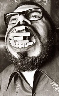 Dave Foster sets a record by cramming in 28 domino pieces into his mouth at his local pub