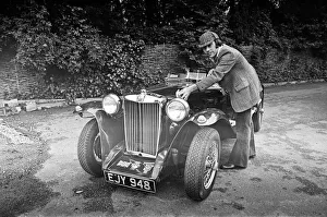 Automobile Prints: Dave Harris, 32, and his 1947 MG TC which he will be driving to Le Mans to see the famous