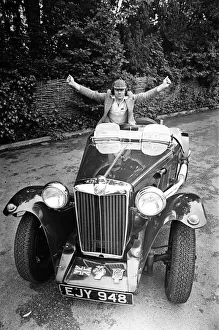 Dave Harris, 32, and his 1947 MG TC which he will be driving to Le Mans to see the famous