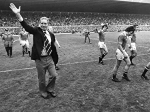 Dave Sexton waves to the crowd as Manchester United go on a lap of honour after the game