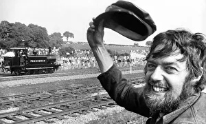 Dave Westcott of Derby throws his hat up in a salute to the little Sussex based Terrier