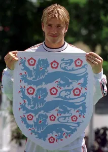 World Cup Prints: David Beckham holds up the three lions badge June 1998 during a England training