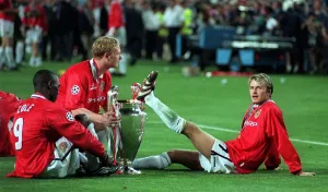 Treble Season Prints: David Beckham Manchester United May 1999 midfielder rests foot on the Champions