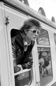 00161 Prints: David Bowie leaning out of a railway carriage of the Paris boat train at Victoria station