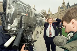 David Dimbleby, journalist and television presenter pictured during some outdoor filming