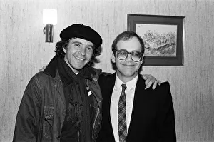 David Essex and Elton John. The two soccer mad fans have just watched their lads do