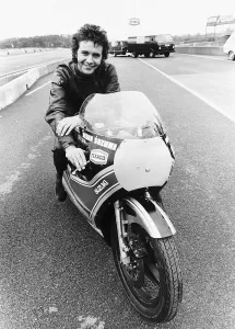 David Essex on the set of his film Silver Dream Racer sitting on a £40