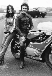 David Essex singer with actress Christina Raines on motorcycle