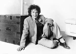Images Dated 31st May 1989: David Essex Singer leaning against a blanket chest