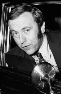 David Frost driving away from his London Home in his Bentley after splitting up with his