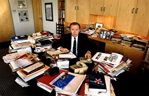 David Frost TV Presenter a glance at his cluttered desk research material