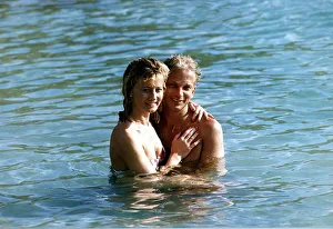 David Gower cricketer with Thorrun Nash in the sea during their visit to the West Indies