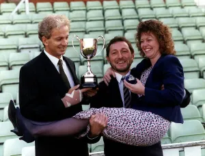 David Gower former England Cricket Captain holds cup presented to Trevor Clifford