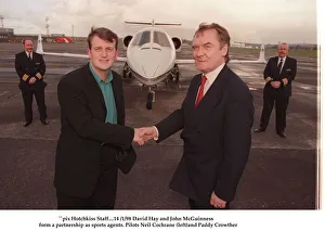 David Hay January 1998 shakes hands with Lottery millionaire John McGuinness with a jet