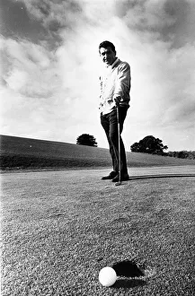 David Lewis Nov 1967 golf professional at East Hert golf club contemplates missed putt